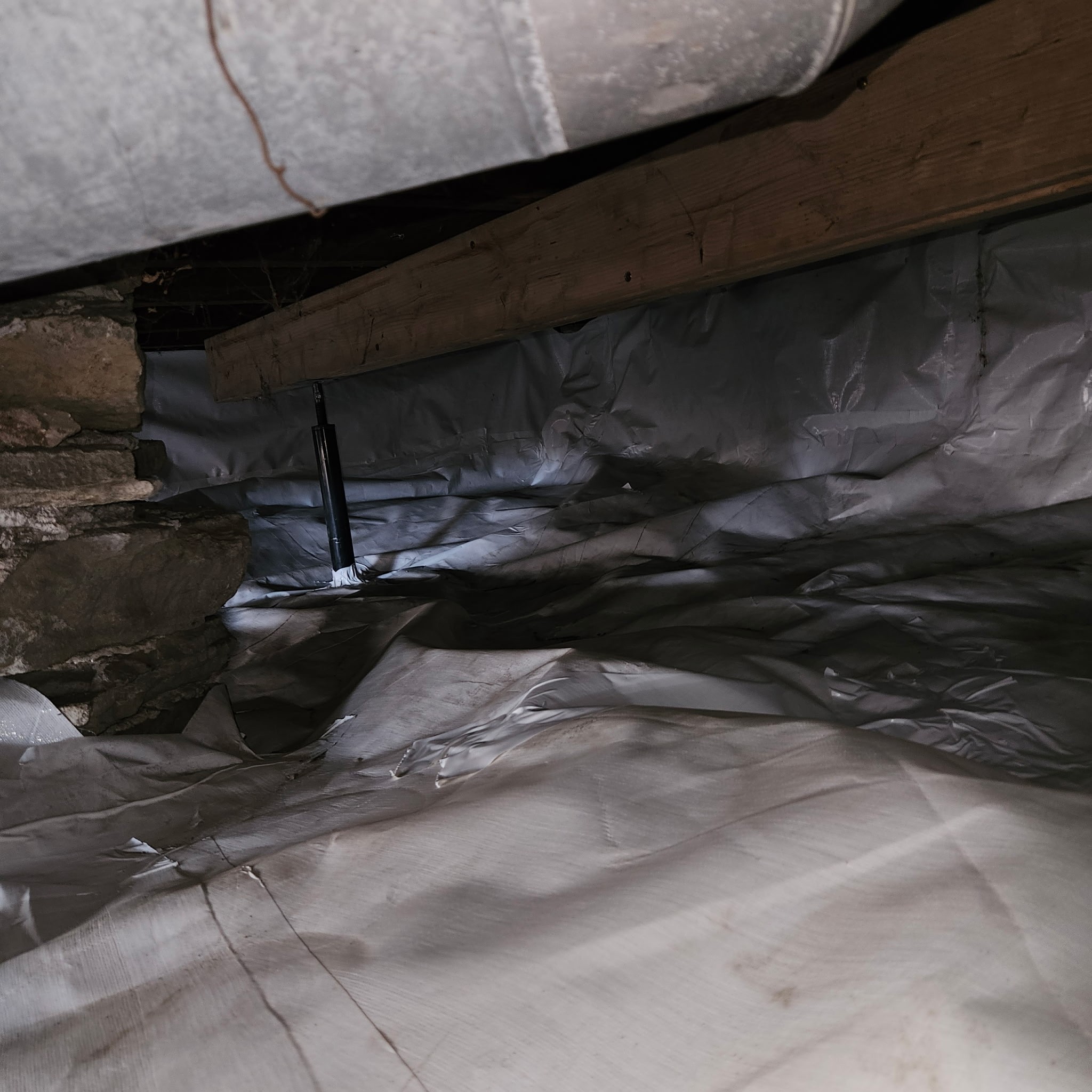 Crawlspace encapsulation with vapor barrier and spray foam insulation