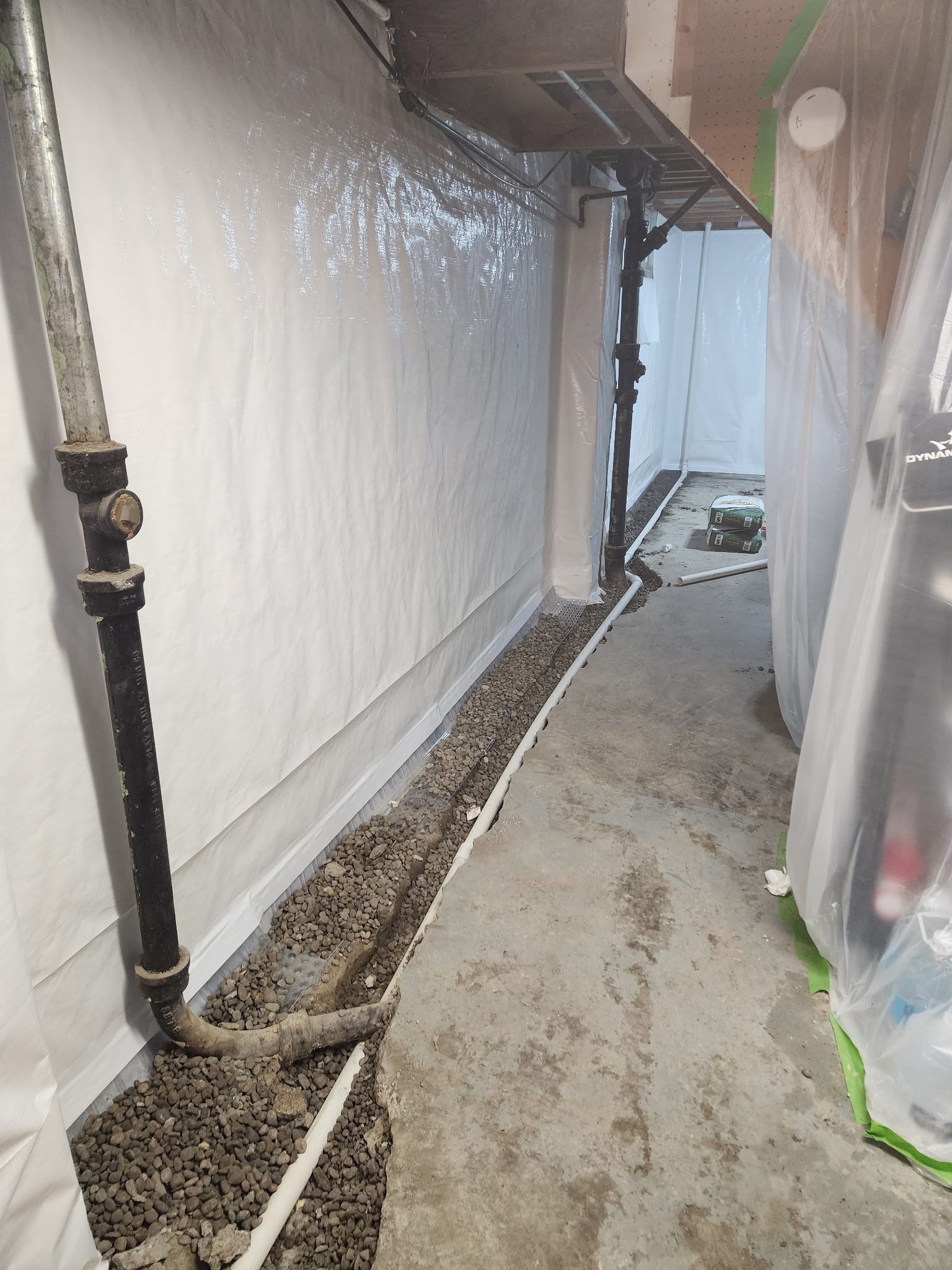 Completed foundation piering project with steel supports visible