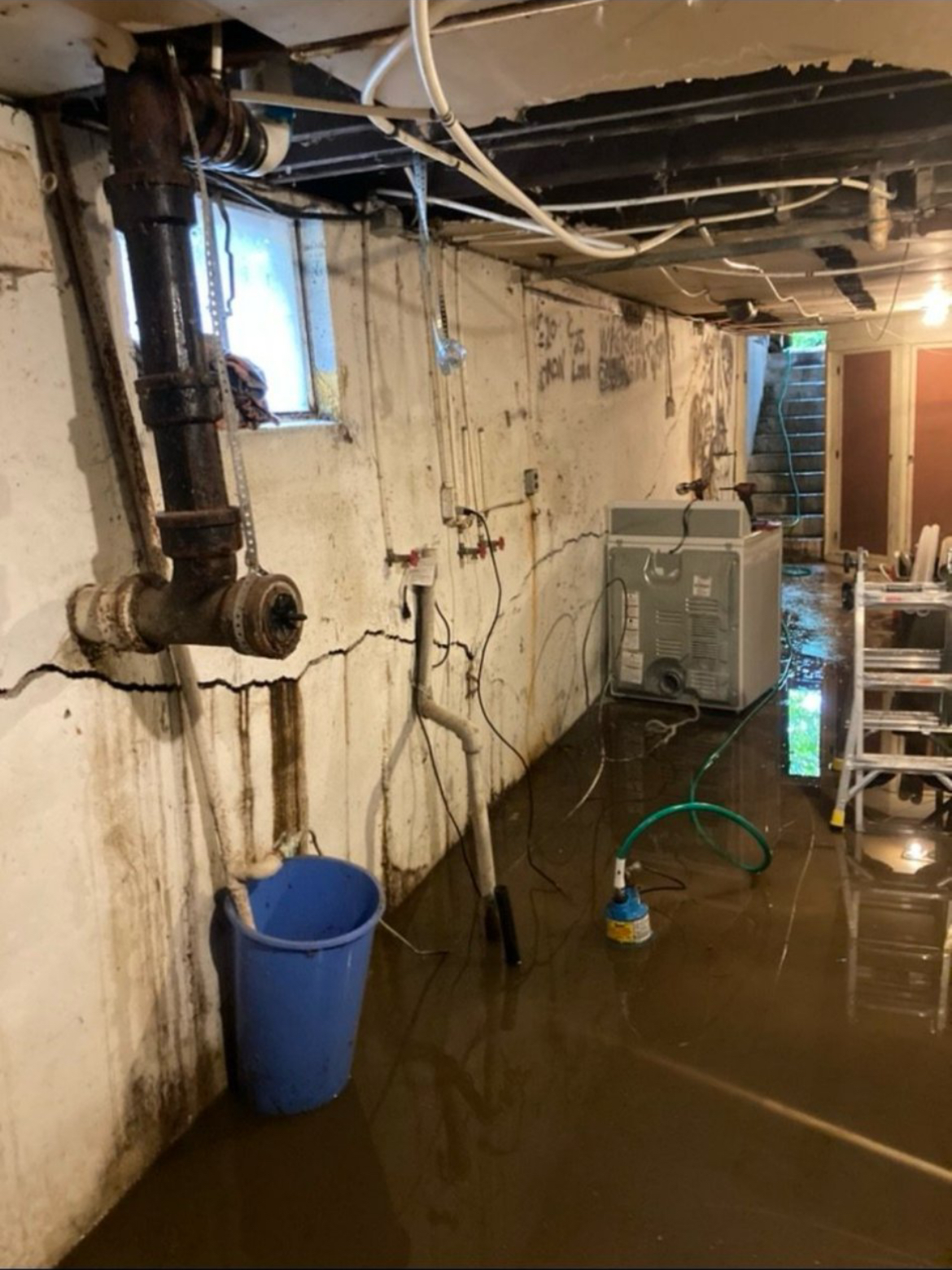 Sump pump basin and discharge line installation